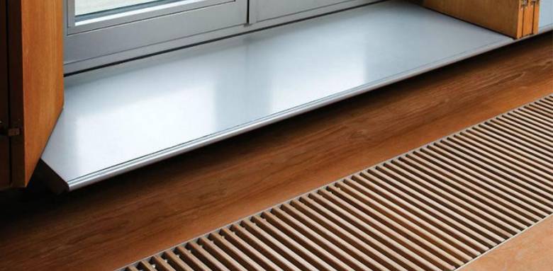Radiateur caniveau sous fenêtre
