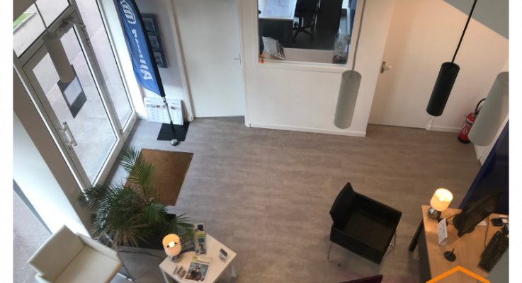 Réfection des peintures d'un commerce à Caen