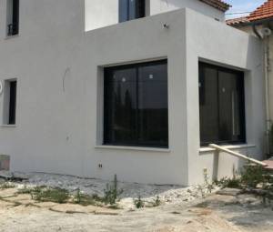 Extension en finition enduit taloché