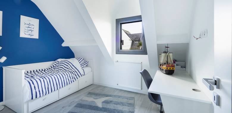 Chambre sous toiture exploitation totale pente avec Velux