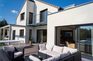 Maison à toiture traditionnelle et toiture terrasse - Le Raincy 93