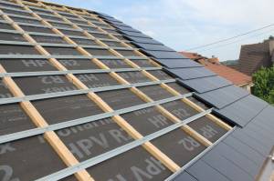 rénovation de toiture en tuiles béton