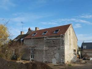 Rénovation de toiture en petites tuiles