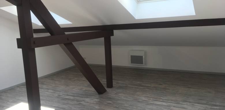Aménagement de combles, poutres apparentes à Saint Louis