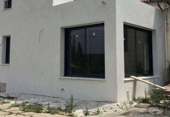 Extension en finition enduit taloché