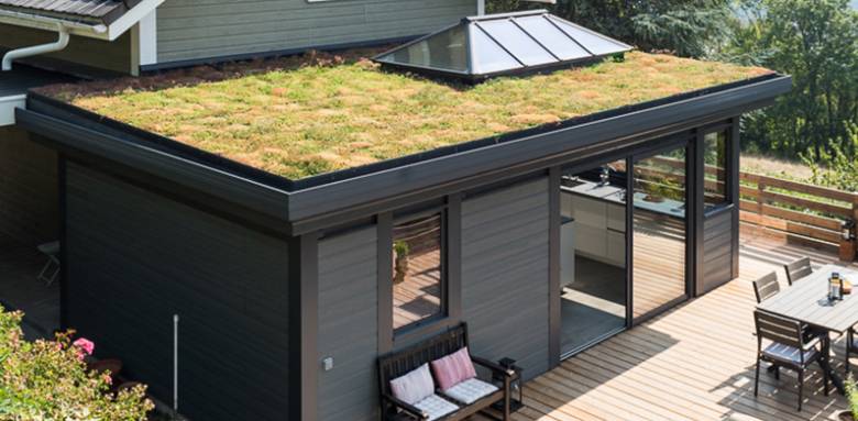 Véranda bioclimatique aluminium toiture végétalisée