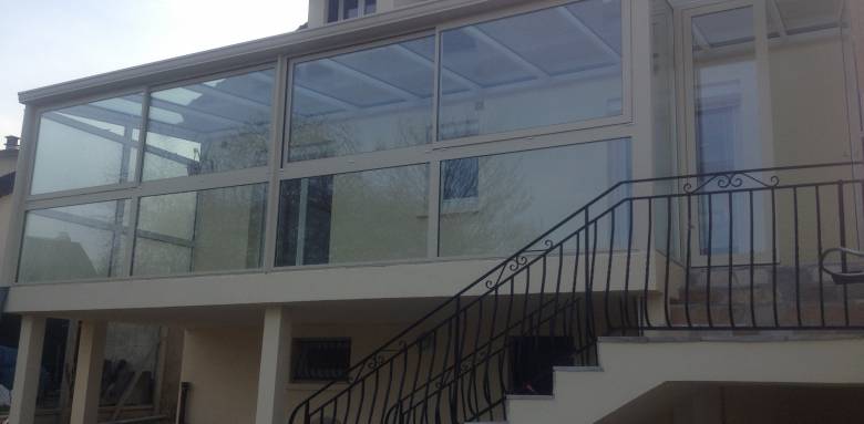 Agrandissement de maison avec terrasse vitrée