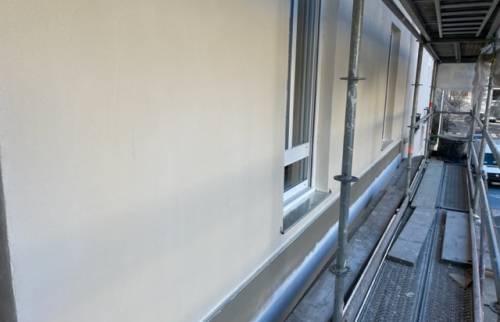 Enduit sur extension à ossature en bois