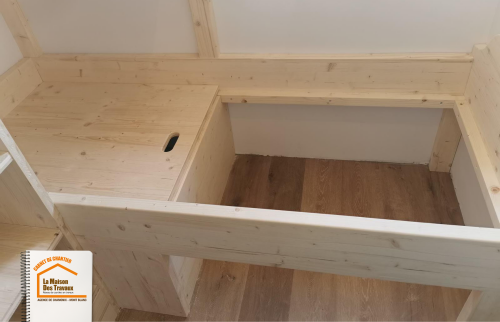 meubles sur-mesure Chamonix, bois local Haute-Savoie, conception lit avec rangement, expertise artisan Chamonix, optimisation espace appartement montagnard, la maison des travaux sallanches