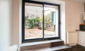 Travaux de maçonnerie pour agrandir une ouverture et poser une baie vitrée, maison dans l'ouest de Lyon, vallée de l'Azergues
