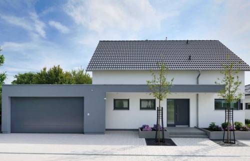 Construction de garage traditionnel, porte motorisée sectionnelle à Saclay