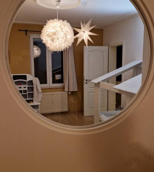 Verrière ronde dans chambre d'enfant à Saint Louis