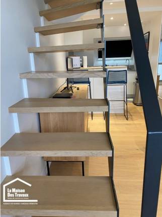 Pose d'une main courante sur poteaux