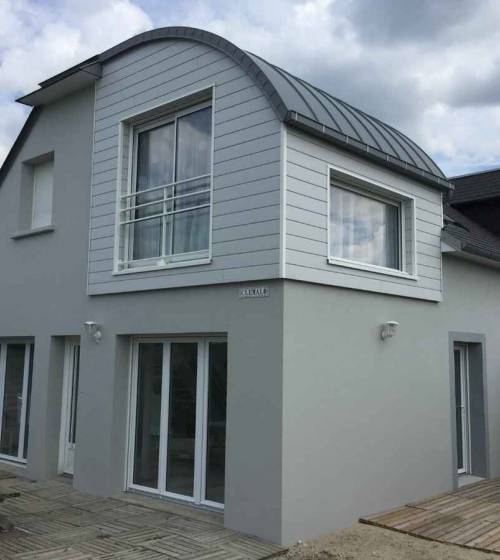 Extension en bois d'une maison à Carolles (50740).