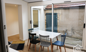 Véranda aménagée en salon