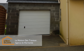 Finitions modernes : Pour allier praticité et confort, une porte de garage sectionnelle motorisée a été installée, offrant une ouverture fluide et sécurisée.