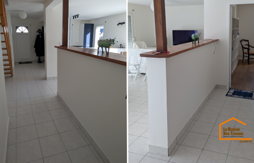 Un couloir modernisé et ouvert sur une pièce de vie rénovée, offrant plus de luminosité et une circulation fluide dans toute la maison.