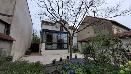 La véranda et les aménagements paysagers