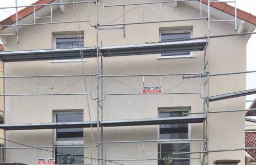 Ravalement en enduit taloché après pose de l'ITE