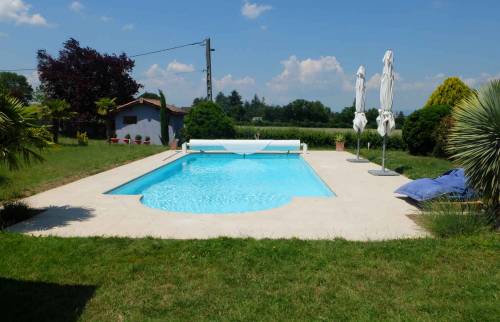 Réalisation d'une terrasse et d'une plage de piscine, maison à Dommartin
