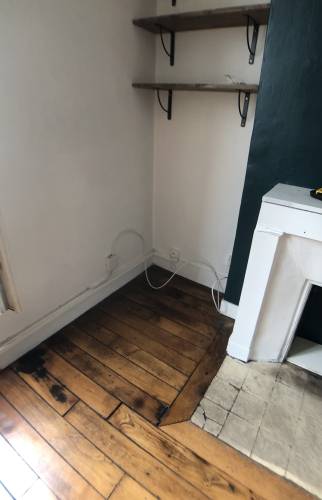Salon avec cheminée avant les travaux - Paris