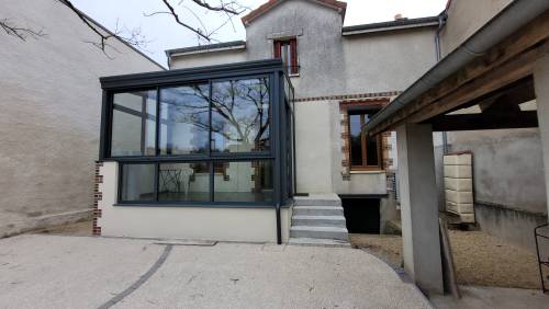 La véranda et les aménagements paysagers