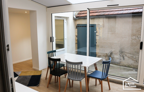 Véranda aménagée en salon