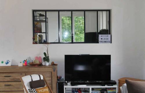 Rénovation d'une maison avec frangement entre le salon et la cuisine et accès par une passerelle à Nantes (44)