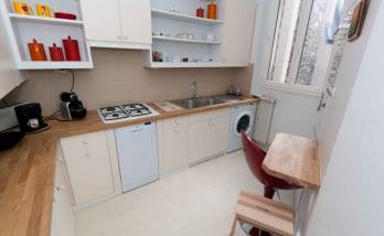 Une cuisine d'angle entièrement aménagée par des artisans de La Maison Des Travaux Boulogne-Saint Cloud