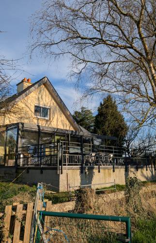 Aperçu de la maison - Travaux terminés avec véranda et terrasse modernisées