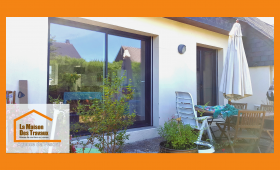 Remplacement de baie vitrée moderne à Luxeuil avec La Maison Des Travaux, agence experte en rénovation extérieure.