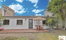 Création d’une terrasse et rénovation de façade arrière près de Sautron après