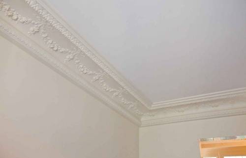 Décors haussmanniens restaurés dans un appartement à Boulogne