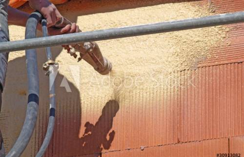 Projection de l'enduit