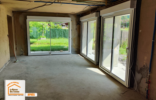 transformation garage pièce de vie, travaux maçonnerie Grand-Bornand, étayage structure maison, pose menuiserie extérieure, espace de vie lumineux, La Maison des Travaux Chamonix Mont-Blanc