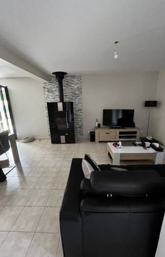 Poêle à bois salon/salle à manger après rénovation  