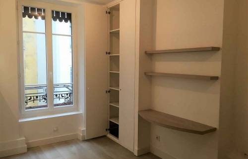 Rénovation et réagencement d'un appartement situé dans le quartier Lyon Brotteaux : chambre et rangements sur mesure
