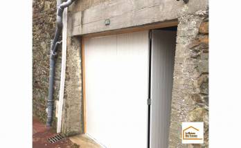 Pose d'une nouvelle porte de garage à Granville (50400).