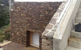 Travaux maçonnerue sur façade en granit bouchardé grège à  Mahalon (29790)