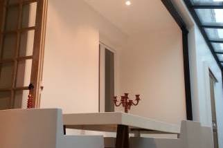 Agrandissement de maison avec toiture verrière en longueur salon salle à manger sur Crozon (29160)