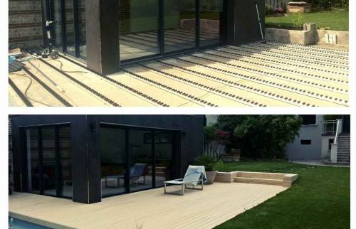Extension de la maison avec la terrasse en bois neuve 