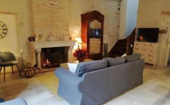 rénovation du salon avec cheminée et pierres apparantes