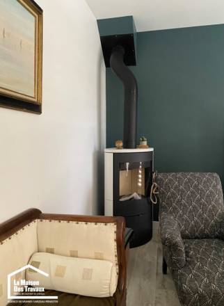 Fourniture d’un poêle à bois en lieu et place de la cheminée