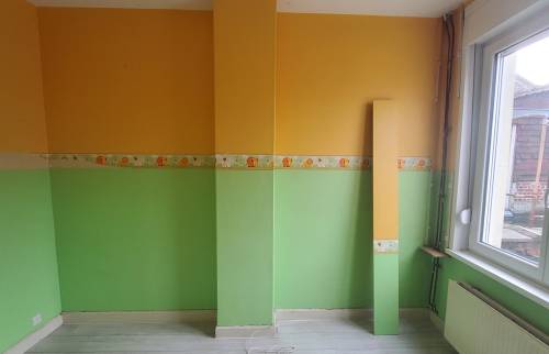 Avant travaux : ancienne cheminée dans une chambre à Harnes.