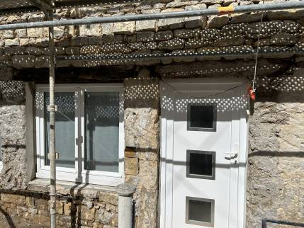 Mur en moellons sous l'enduit (Ouistreham 14150)