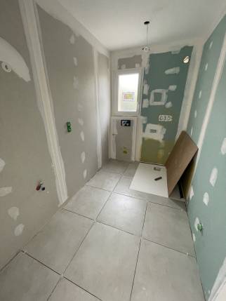 Travaux de création de salle de bain dans le garage transformé en espace habitable - Viriville 38980