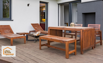 Terrasse moderne réalisée entre Brax et Agen avec revêtement composite, espace repas et coin détente pour profiter pleinement des beaux jours.