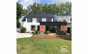 Agrandissement de maison en bois et en zinc