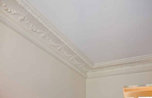 Décors haussmanniens restaurés dans un appartement à Boulogne