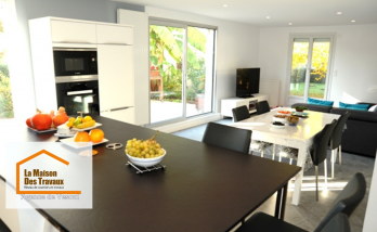 Cuisine moderne rénovée à Lure – Espace lumineux avec îlot central, meubles blancs et touches de rouge. Design élégant et fonctionnel.